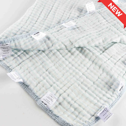 Blue baby blanket with soft fabric and smooth silk labels designed for calming comfort
