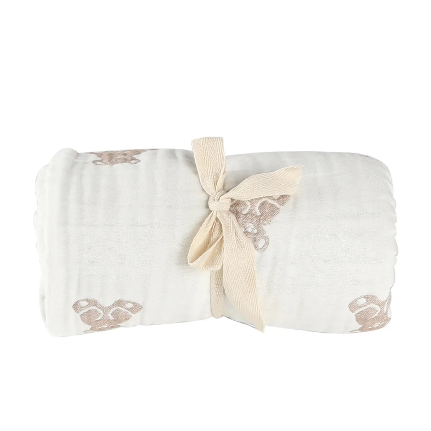 Folded teddy baby blanket with a bow on a white background